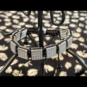 Premier CZ bracelet on black nylon thread bracelet